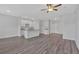 Spacious living room featuring hardwood floors, recessed lighting, and an open layout connected to the kitchen at 8664 Webb Rd, Riverdale, GA 30274