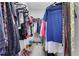 Walk-in closet with ample space for hanging clothes and storing shoes at 132 Cessna Dr, Canton, GA 30114