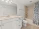 Bathroom with vanity, tile flooring, and a shower and tub combo with a decorative curtain at 2870 Pharr Court South Nw # 2901, Atlanta, GA 30305