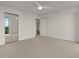 Large bedroom with a ceiling fan, closet, and an open door to the living area at 2870 Pharr Court South Nw # 2901, Atlanta, GA 30305