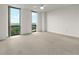 Bright bedroom with large windows showcasing serene views and ceiling fan at 2870 Pharr Court South Nw # 2901, Atlanta, GA 30305