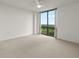 Bright bedroom with a ceiling fan and large window showing treetop views at 2870 Pharr Court South Nw # 2901, Atlanta, GA 30305