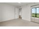 Bedroom featuring closet with mirrored doors and large view window at 2870 Pharr Court South Nw # 2901, Atlanta, GA 30305
