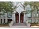 Grand building entrance with symmetrical facade, stone exterior, and inviting double doors at 2870 Pharr Court South Nw # 2901, Atlanta, GA 30305