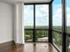 Corner windows with curtains showing outside views of the surrounding neighborhood and bright skies at 2870 Pharr Court South Nw # 2901, Atlanta, GA 30305