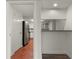Hallway view leading to an updated kitchen with stainless steel appliances at 2870 Pharr Court South Nw # 2901, Atlanta, GA 30305