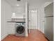 Laundry room featuring a modern washing machine, adjacent to the kitchen at 2870 Pharr Court South Nw # 2901, Atlanta, GA 30305