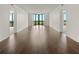 Spacious living room featuring dark hardwood floors and expansive windows for natural light at 2870 Pharr Court South Nw # 2901, Atlanta, GA 30305