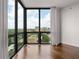 Sun-filled living room offers expansive windows with stunning views and hardwood flooring at 2870 Pharr Court South Nw # 2901, Atlanta, GA 30305