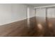 Spacious living area featuring hardwood floors, white walls, and ample natural light at 2870 Pharr Court South Nw # 2901, Atlanta, GA 30305