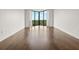 Bright, spacious living room with hardwood floors and floor to ceiling corner windows at 2870 Pharr Court South Nw # 2901, Atlanta, GA 30305