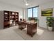 Inviting home office with large window, classic wood desk and bookcase, and ample natural light at 2870 Pharr Court South Nw # 2901, Atlanta, GA 30305