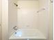 A full bath with tub shower featuring tiled walls and bright lighting at 3969 Briaridge Cir, Atlanta, GA 30340