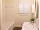 A bright bathroom with shuttered windows, white fixtures, and a modern aesthetic at 3969 Briaridge Cir, Atlanta, GA 30340