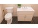 Well lit bathroom featuring a white sink, white toilet and decorative tile flooring at 3969 Briaridge Cir, Atlanta, GA 30340