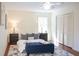 Bedroom featuring a bed, rug, two dressers, and a ceiling fan at 3969 Briaridge Cir, Atlanta, GA 30340