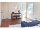 Bedroom features hard wood floors, two doors, and a decorative table at 3969 Briaridge Cir, Atlanta, GA 30340