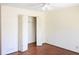 Bright bedroom offers natural light and ample storage, with hardwood floors and a fan at 3969 Briaridge Cir, Atlanta, GA 30340