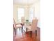 Elegant dining area featuring a glass table, decorative chairs, and modern chandelier at 3969 Briaridge Cir, Atlanta, GA 30340