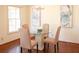 Bright dining room with a round glass table, upholstered chairs, and chandelier at 3969 Briaridge Cir, Atlanta, GA 30340