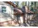 View of the back of the house showcasing a brick chimney and architectural details at 3969 Briaridge Cir, Atlanta, GA 30340