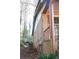 View of the side of the home showing brick, siding, and architectural details at 3969 Briaridge Cir, Atlanta, GA 30340
