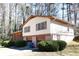 Side view of the home with a brick and siding exterior, and an attached garage at 3969 Briaridge Cir, Atlanta, GA 30340