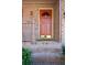Inviting orange front door with brick steps and railing, enhancing curb appeal at 3969 Briaridge Cir, Atlanta, GA 30340