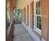 Close-up view of the charming covered front porch showing railing and orange shutters at 3969 Briaridge Cir, Atlanta, GA 30340