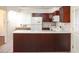 Well-lit kitchen featuring dark wood cabinets, white countertops, and an open layout at 3969 Briaridge Cir, Atlanta, GA 30340