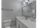 Modern bathroom features a vanity, toilet and decorative mirror at 346 Carpenter Dr # 29, Atlanta, GA 30328