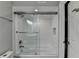 Elegant bathroom featuring sleek glass shower doors, a modern shower head, and stylish white tile at 346 Carpenter Dr # 29, Atlanta, GA 30328