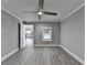 Light-filled bedroom with gray flooring, offering a glimpse into the adjacent kitchen, creating a sense of openness at 346 Carpenter Dr # 29, Atlanta, GA 30328