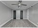 Inviting bedroom showcasing stylish gray flooring and a contemporary ceiling fan for added comfort at 346 Carpenter Dr # 29, Atlanta, GA 30328