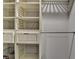 Organized closet with adjustable shelves, drawers, and wire baskets for efficient storage solutions at 346 Carpenter Dr # 29, Atlanta, GA 30328