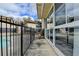 Exterior view of a building, showcasing the balcony, pool area, and providing a glimpse of the outdoor amenities at 346 Carpenter Dr # 29, Atlanta, GA 30328