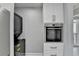 Kitchen featuring stacked washer/dryer and built-in oven at 346 Carpenter Dr # 29, Atlanta, GA 30328