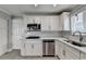 Well-equipped kitchen with stainless steel appliances and crisp white cabinetry at 346 Carpenter Dr # 29, Atlanta, GA 30328