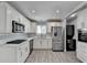 Well-equipped kitchen with stainless steel appliances and crisp white cabinetry at 346 Carpenter Dr # 29, Atlanta, GA 30328