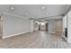 Bright open concept kitchen with white cabinetry, stainless steel appliances, and luxury vinyl plank flooring at 346 Carpenter Dr # 29, Atlanta, GA 30328