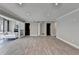 Spacious living room with modern lighting, light grey walls and luxury vinyl plank flooring at 346 Carpenter Dr # 29, Atlanta, GA 30328