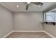 Living room with wood flooring, white trim, bar to additional living space, and ceiling fan at 346 Carpenter Dr # 29, Atlanta, GA 30328
