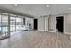 Open living room features wood-look floors and access to outdoor pool at 346 Carpenter Dr # 29, Atlanta, GA 30328