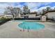 Inviting community pool with a shallow wading area, surrounded by well-maintained landscaping and comfortable lounge area at 346 Carpenter Dr # 29, Atlanta, GA 30328
