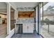 Sunroom wet bar with stone backsplash, and convenient mini-fridge, perfect for entertaining near the community pool at 346 Carpenter Dr # 29, Atlanta, GA 30328