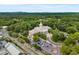 Aerial view of a civic building with dome, parking lots, and mature trees surrounding it at 355 Highlands Trce, Roswell, GA 30075
