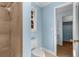 Stylish bathroom with a tiled shower, modern toilet, and access to other rooms at 355 Highlands Trce, Roswell, GA 30075