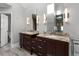 Bright bathroom with a double vanity, granite countertops, and modern lighting at 355 Highlands Trce, Roswell, GA 30075