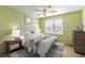 Bright bedroom featuring a ceiling fan, a large window, and neutral walls at 355 Highlands Trce, Roswell, GA 30075