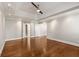 Bright, open bedroom with tray ceiling, hardwood floors, and multiple closets at 355 Highlands Trce, Roswell, GA 30075